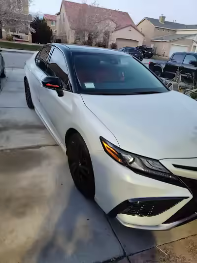 White sedan with tinted windows